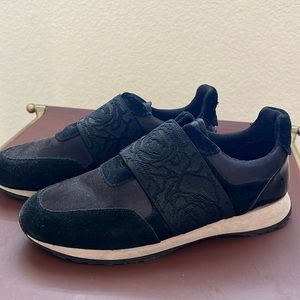 Black velvet tennis shoes, slip on-black patent on the heel area. Size 8.5-9